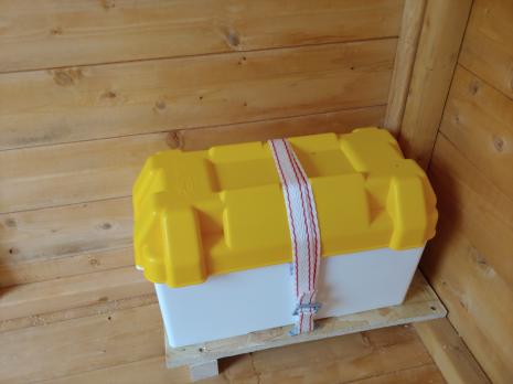 Battery box with a yellow lid