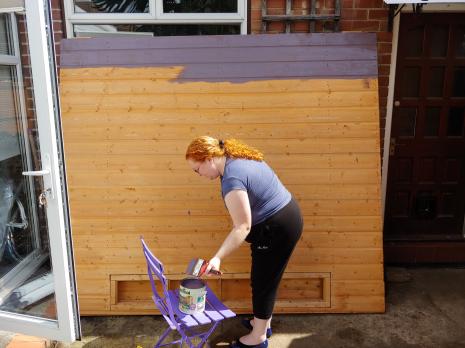 My wife painting one of the side panels